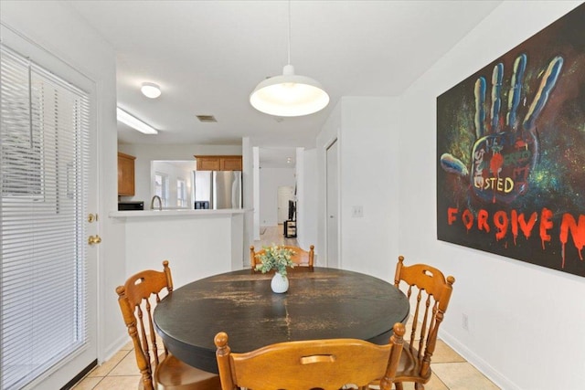 21223 Byerly Turk Dr, Pflugerville, TX 78660 - dining area featuring light tile patterned floors and baseboards