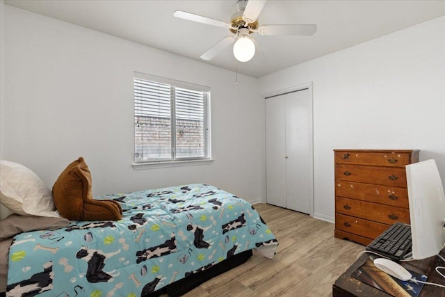 21223 Byerly Turk Dr, Pflugerville, TX 78660 - bedroom featuring light wood-type flooring, a closet, and a ceiling fan