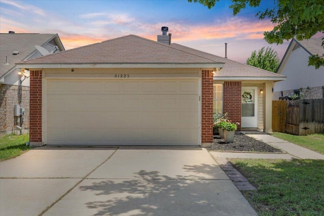 21223 Byerly Turk Dr, Pflugerville, TX 78660 - ranch-style home with brick siding, concrete driveway, a garage, and a chimney