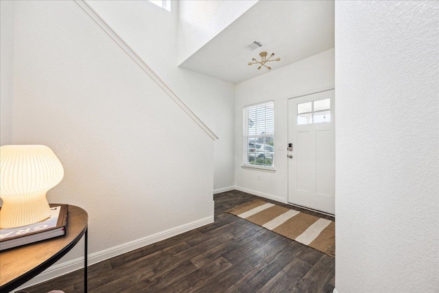 148 Feather Grass Ave, Leander, TX 78641 - entrance foyer with dark wood-style flooring and baseboards