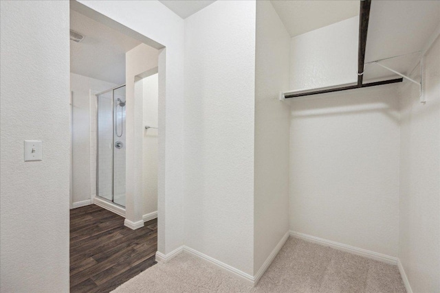 spacious closet with wood finished floors