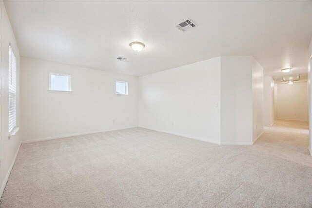 basement featuring carpet floors and baseboards