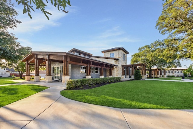 view of property's community with a lawn