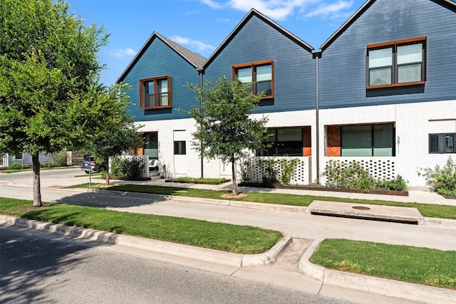 view of property with brick siding