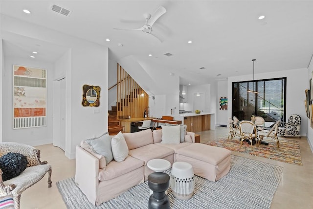 living area featuring stairs, recessed lighting, and ceiling fan