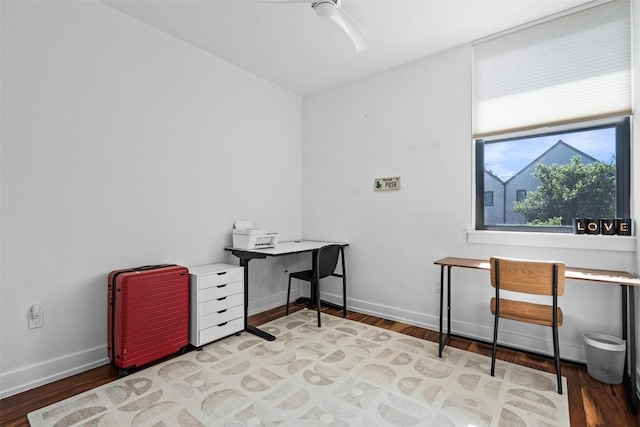 home office featuring wood finished floors and baseboards