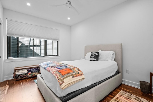 bedroom with wood finished floors, recessed lighting, baseboards, and ceiling fan