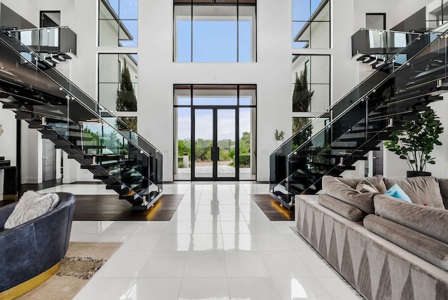 912 Watercliffe, Lago Vista, TX 78645 - foyer entrance featuring stairway, tile patterned flooring, and a high ceiling