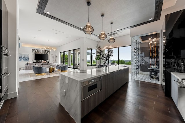 912 Watercliffe, Lago Vista, TX 78645 - kitchen featuring modern cabinets, a chandelier, recessed lighting, dark wood finished floors, and open floor plan