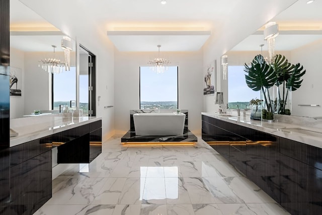 912 Watercliffe, Lago Vista, TX 78645 - bathroom with a chandelier, vanity, a soaking tub, marble finish flooring, and recessed lighting