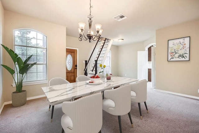 258 W Oak Loop, Cedar Creek, TX 78612 - dining space with light carpet, stairway, a chandelier, and baseboards