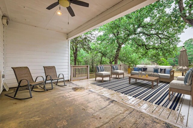 view of patio with outdoor lounge area and a ceiling fan