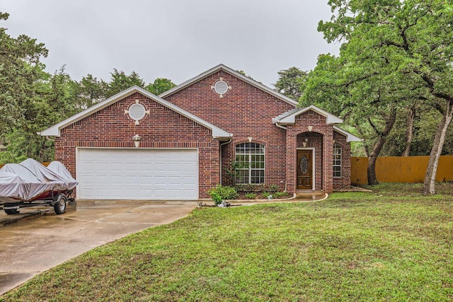 traditional-style house featuring brick siding, a garage, and driveway