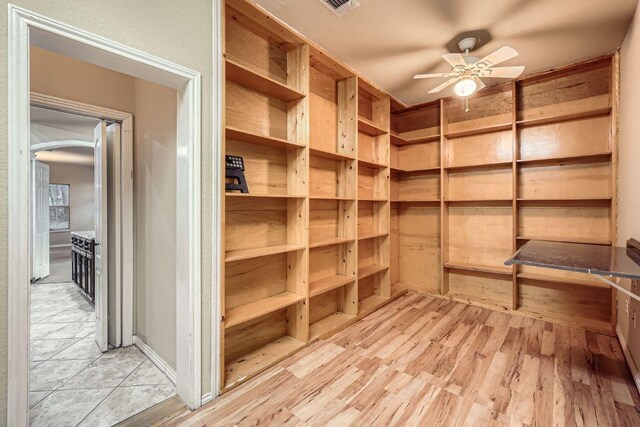 storage room with ceiling fan