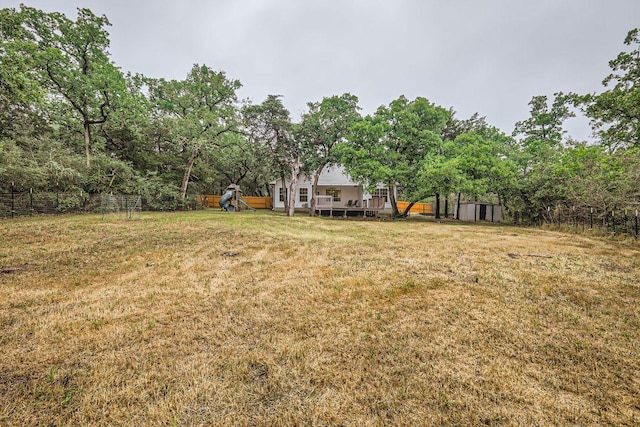 258 W Oak Loop, Cedar Creek, TX 78612 - view of yard featuring a playground and a deck
