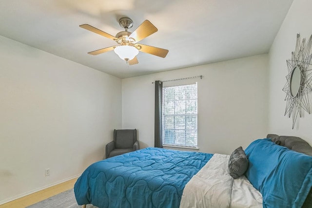 300 Crockett St Unit 210, Austin, TX 78704 - bedroom with light wood-style floors, baseboards, and ceiling fan