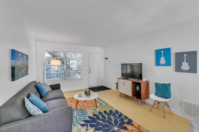 300 Crockett St Unit 210, Austin, TX 78704 - living room featuring wood finished floors and baseboards