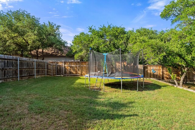 8909 Gallant Fox Rd, Austin, TX 78737 - view of yard featuring a trampoline