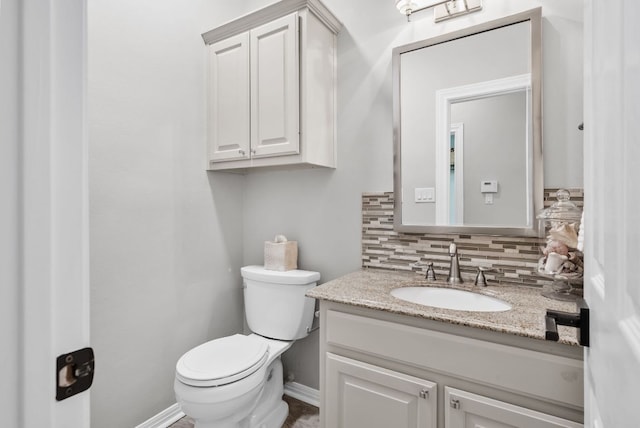 8909 Gallant Fox Rd, Austin, TX 78737 - bathroom with vanity, decorative backsplash, and toilet