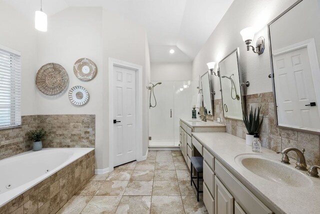 8909 Gallant Fox Rd, Austin, TX 78737 - full bathroom with lofted ceiling, double vanity, a shower stall, and a jetted tub