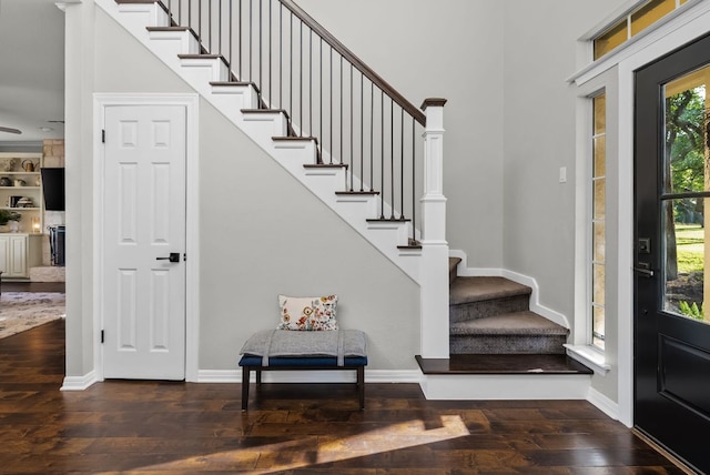 8909 Gallant Fox Rd, Austin, TX 78737 - foyer entrance with hardwood / wood-style flooring, stairway, baseboards, and a high ceiling