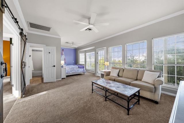8909 Gallant Fox Rd, Austin, TX 78737 - bedroom featuring a barn door, carpet, ornamental molding, baseboards, and ceiling fan