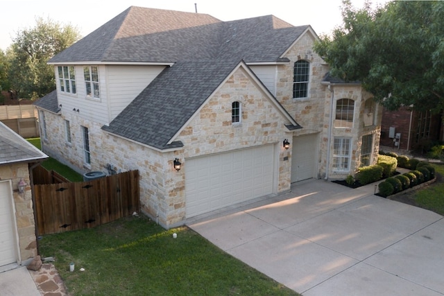 2702 Quiet Moon Trl, Cedar Park, TX 78613 - french provincial home featuring stone siding, roof with shingles, and concrete driveway