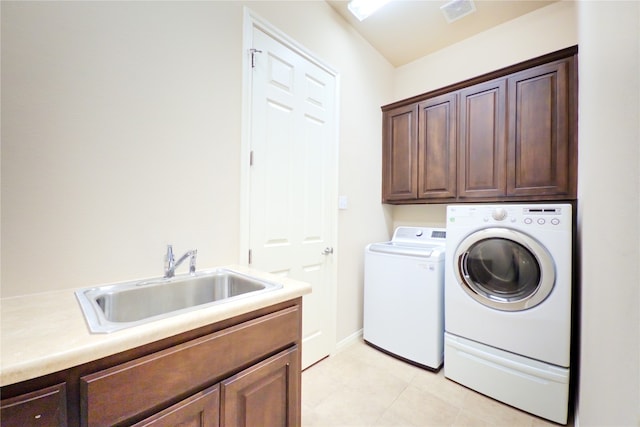 2702 Quiet Moon Trl, Cedar Park, TX 78613 - laundry area featuring cabinet space, independent washer and dryer, and light tile patterned flooring