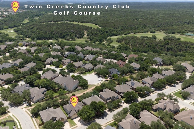 aerial view of residential area featuring a heavily wooded area