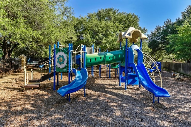 communal playground featuring fence