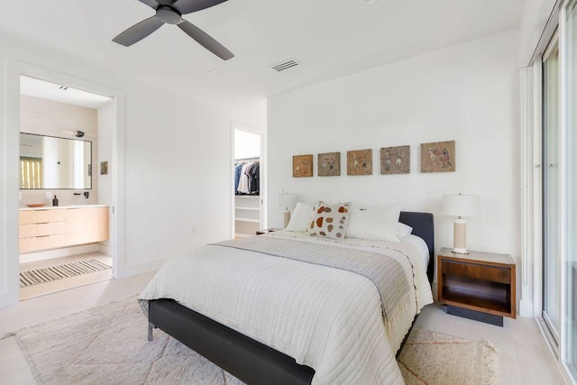 2305 E 17th St Unit B, Austin, TX 78702 - bedroom featuring a closet, connected bathroom, a spacious closet, and a ceiling fan