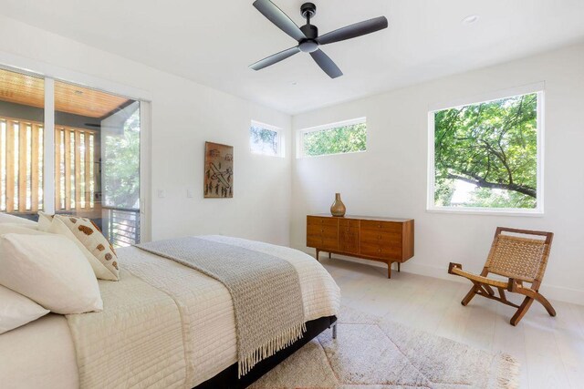 2305 E 17th St Unit B, Austin, TX 78702 - bedroom featuring light wood-style floors, baseboards, and a ceiling fan