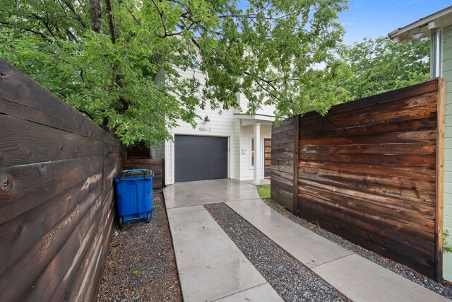 1204 W 51st St Unit 2, Austin, TX 78756 - garage with fence and driveway