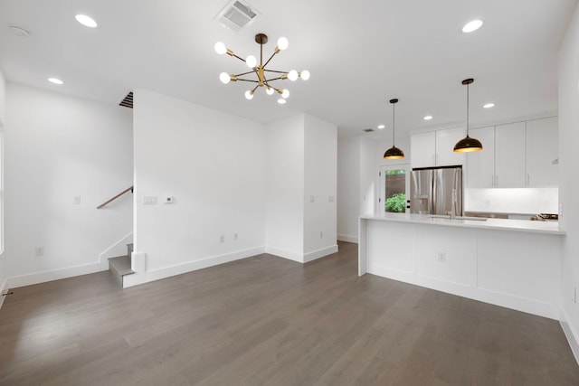 1204 W 51st St Unit 2, Austin, TX 78756 - unfurnished living room featuring dark wood-style floors, a chandelier, recessed lighting, baseboards, and stairway