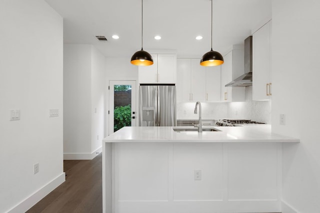 1204 W 51st St Unit 2, Austin, TX 78756 - kitchen featuring stainless steel fridge with ice dispenser, wall chimney exhaust hood, a sink, baseboards, and recessed lighting