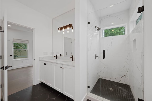 1204 W 51st St Unit 2, Austin, TX 78756 - bathroom featuring a marble finish shower, plenty of natural light, double vanity, and tile patterned floors