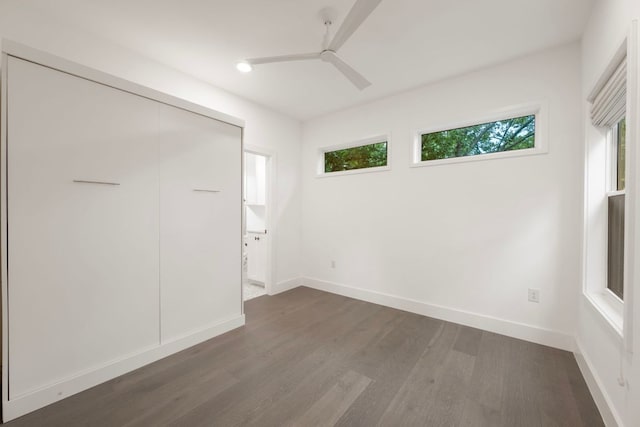 1204 W 51st St Unit 2, Austin, TX 78756 - unfurnished bedroom featuring dark wood-style flooring, baseboards, ceiling fan, recessed lighting, and a closet