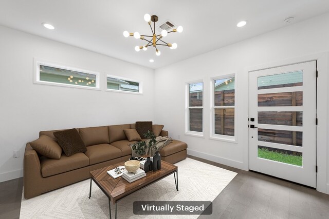 1204 W 51st St Unit 2, Austin, TX 78756 - living room featuring a chandelier, baseboards, recessed lighting, and wood finished floors
