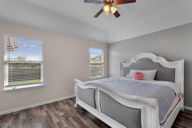 bedroom with wood finished floors, baseboards, ceiling fan, and vaulted ceiling