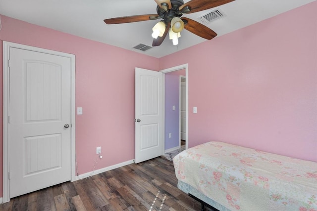 bedroom with dark wood finished floors, baseboards, and a ceiling fan