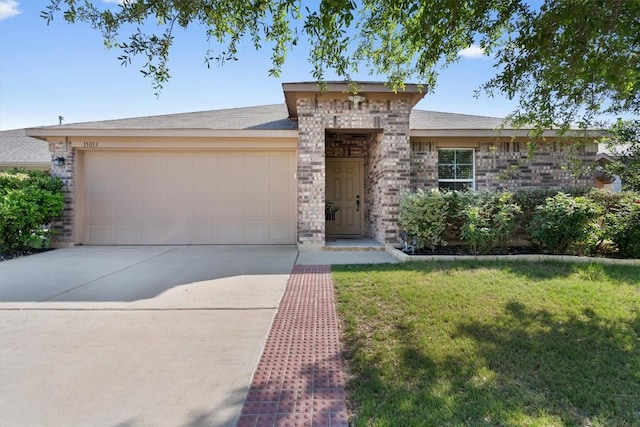 ranch-style house with an attached garage, driveway, a front lawn, and brick siding