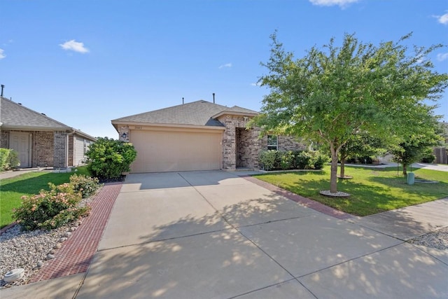 view of front of house featuring brick siding, a garage, driveway, and a front lawn