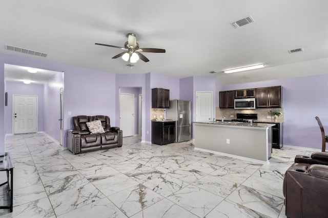 living room with ceiling fan, light marble finish flooring, and baseboards