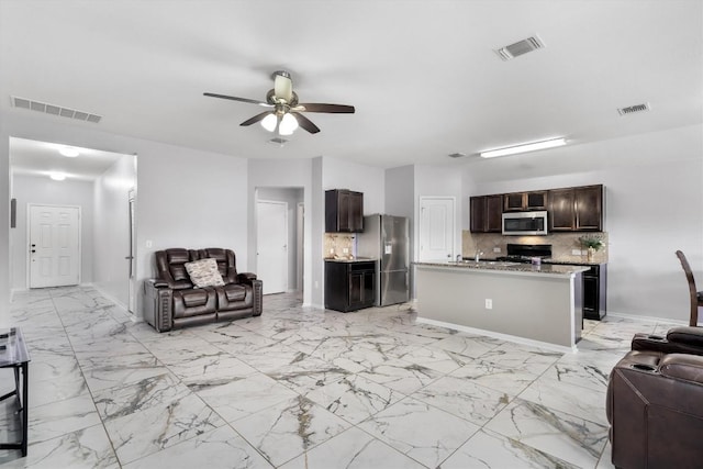 15013 Roody Ln, Austin, TX 78725 - living room with ceiling fan, light marble finish flooring, and baseboards
