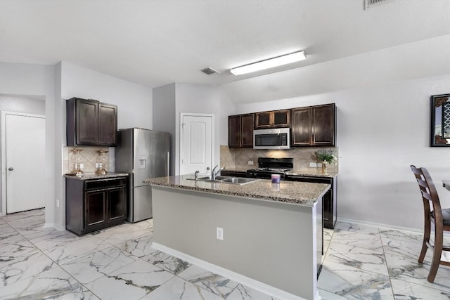 15013 Roody Ln, Austin, TX 78725 - kitchen with appliances with stainless steel finishes, light marble finish floors, a sink, dark brown cabinets, and vaulted ceiling