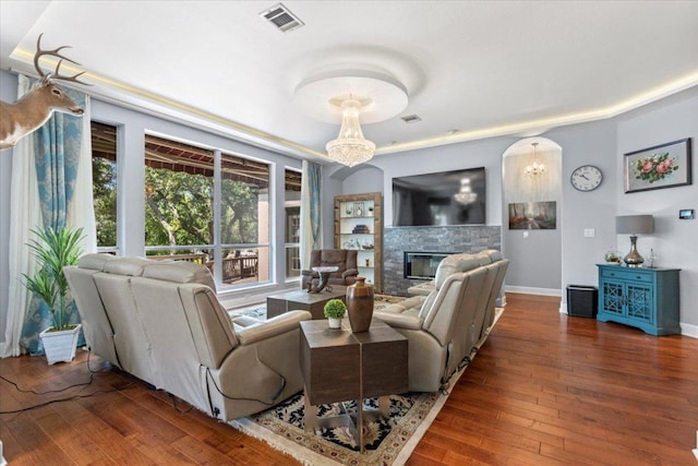 12013 Tarraza Ct, Austin, TX 78732 - living room with hardwood / wood-style floors, a glass covered fireplace, and baseboards