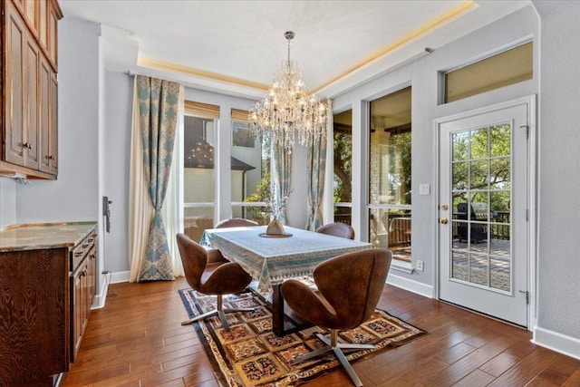 12013 Tarraza Ct, Austin, TX 78732 - dining space with a chandelier, dark wood-style floors, and baseboards