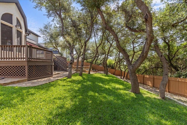 12013 Tarraza Ct, Austin, TX 78732 - fenced backyard with a wooden deck and stairs