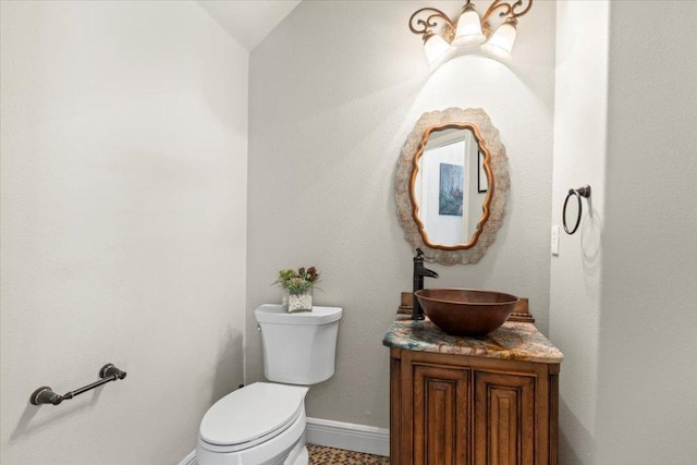 12013 Tarraza Ct, Austin, TX 78732 - half bath featuring toilet, baseboards, and vanity