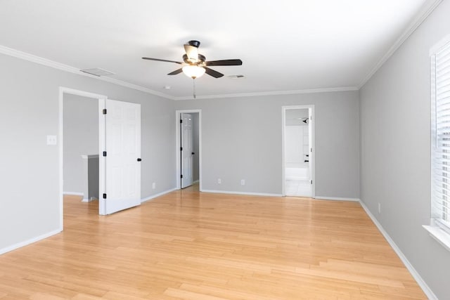 601 Abundance Ln, Kyle, TX 78640 - spare room with ceiling fan, light wood-style floors, baseboards, and crown molding